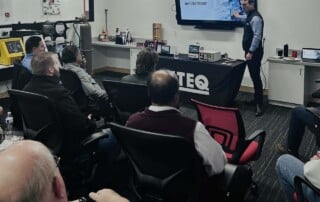 Davy presenting ATEQ and leak testing principles to SME Tour attendees at the Livonia headquarters